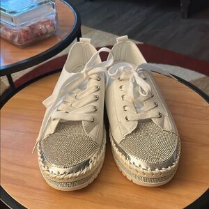 Women's White and Silver shoe.